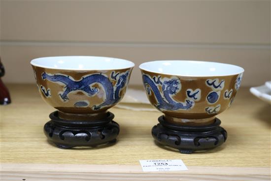 A pair of Chinese cafe au lait glazed dragon bowls Diameter 10.5cm.